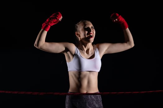 She is an athlete after winning the fight in sports competitions. A fight won by a professional sports player. Strong woman.