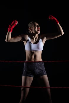 She is an athlete after winning the fight in sports competitions. A fight won by a professional sports player. Strong woman.