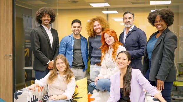 Multi-ethnic team of coworkers smiling at camera together