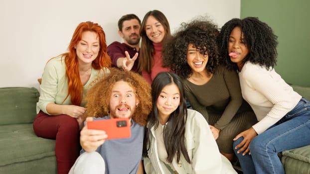 Group of diverse multi-ethnic friends taking a selfie at home