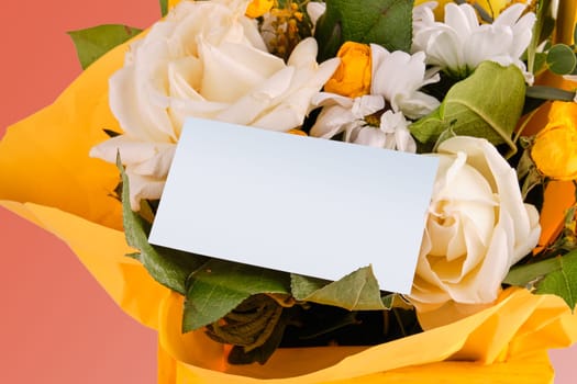 A bouquet of flowers and leaves with a card for recording A place to copy. The concept of love, development, and spiritual values