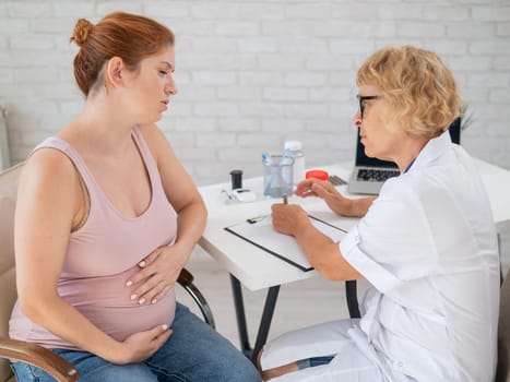 Unhappy pregnant woman at the doctor's appointment