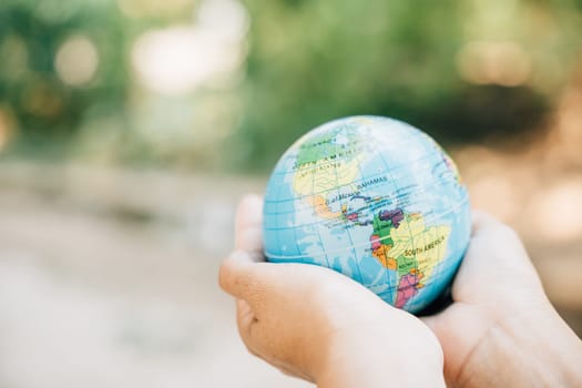 Embrace the globe and a green leaf on World Earth Day to convey the concepts of Green Energy, ESG, and Environmental Care. Signify responsibility and global support for our environment.