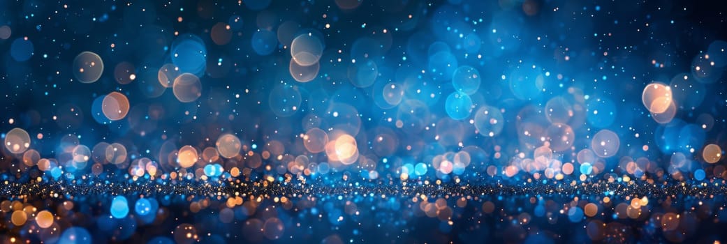 A blurry image of a blue and gold background with lights