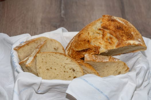 Sliced ​​bread consisting of assorted slices of white and whole wheat flour in a bread bin, high angle view