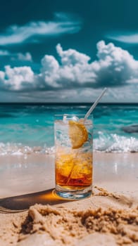 A drink on a beach with the ocean in background