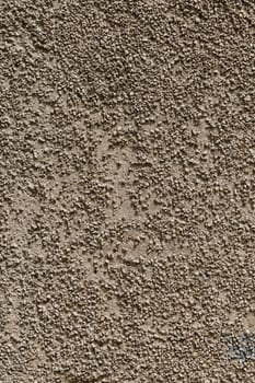 small gravel stucco wall finish texture and full-frame background.