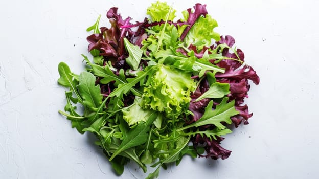 A pile of lettuce on a white surface with some greens
