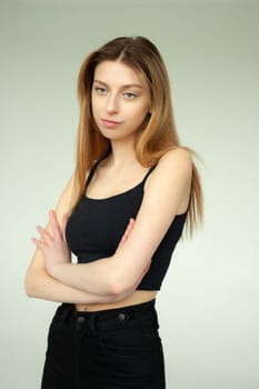 Model test portrait with young beautiful fashion model posing on background.