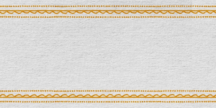 A detailed view of a white fabric with a prominent yellow stripe running through it. The fabric appears to be smooth and well-crafted, showcasing the simplicity and elegance of the design.