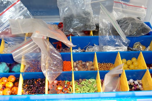 A blue bin overflowing with an assortment of different foods, including fruits, vegetables, canned goods, and packaged items. The variety of foods creates a colorful and diverse display within the bin.