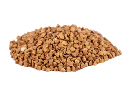 Raw buckwheat grains isolated on white background. Healthy food and ingredient concept