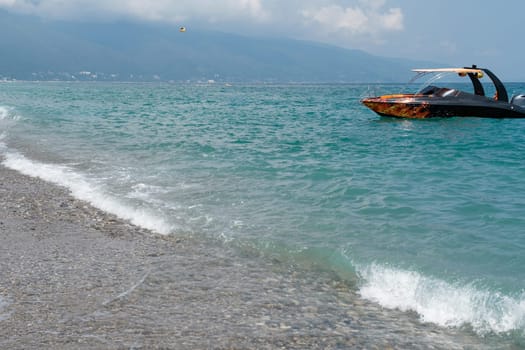 View of a tourist boat on the Black Sea coast in Abkhazia.