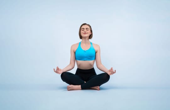 Full body length gaiety shot athletic and sporty woman doing healthy and meditative yoga exercise workout posture on isolated background. Healthy active and body care lifestyle