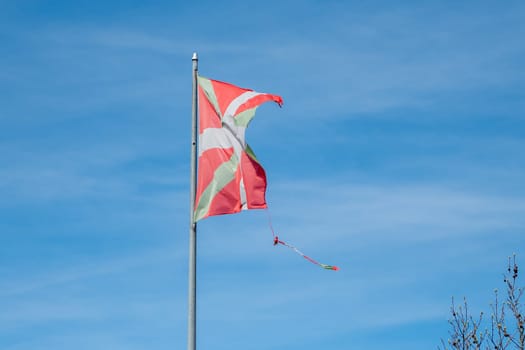 Ikurriña, the flag of the Basque Country damaged by the weather in the fishing and tourist town of Pasaia in the Province of Guipúzcoa in March 2024.