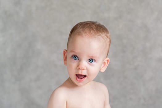 Confused look of a kid close-up of a cute beautiful face.