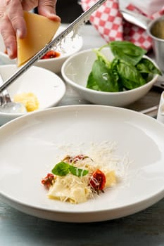 Fresh pasta with sauce in a whole parmesan wheel