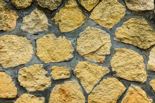 The wall is made of natural stone. Can be used as a background. 2