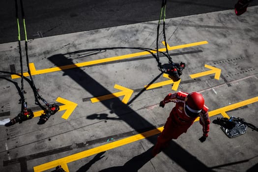 MELBOURNE, AUSTRALIA - MARCH 24: Scuderia Ferrari pit crew before winning the 2024 Australian Grand Prix at Albert Park in Melbourne, Australia