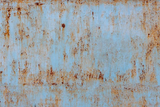 faded blue paint on flat sheet steel surface with stains of rust - full-frame background and texture.