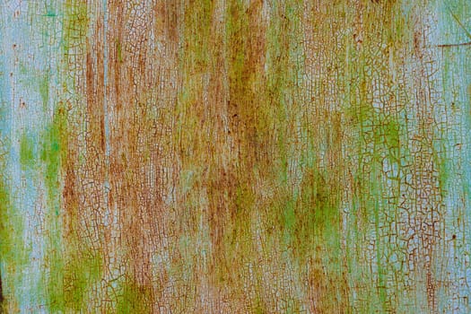 faded green paint on surface of flat sheet steel with stains of rust - full-frame background and texture.