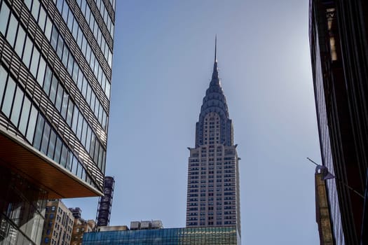 new york city manhattan skyscrapers view from the street to the top of the building on sunny clear day