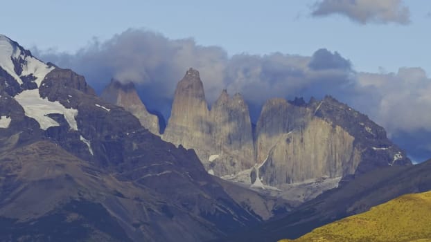 Stunning video shows sunrise over Torres Del Paine, lighting up clouds and mountain peaks.