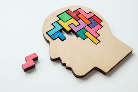 Brain made of puzzle pieces, one missing. Problem solving, creativity and inspiration concept.