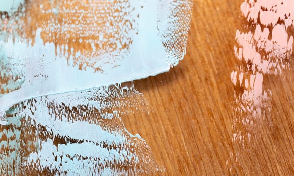 Fragment of multicolored texture painting on plywood. Abstract art background. oil on canvas. Rough brushstrokes of paint. Closeup of a painting by oil and palette knife. Highly-textured, high quality details.