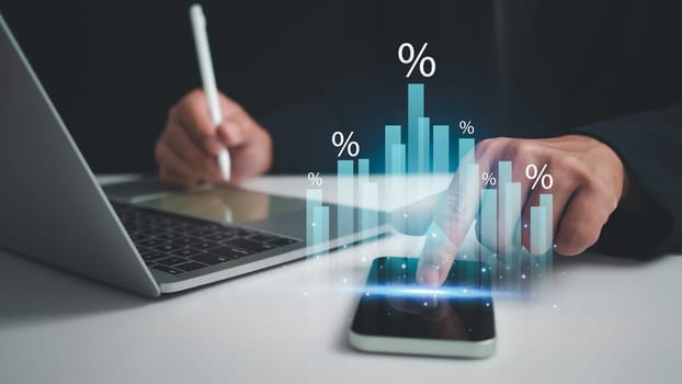 Business development concepts for success and growth. Businessman taps his finger on his phone to display a graph with percentage signs for the future growth plan of his organization. finance, management, plan, management, strategy,