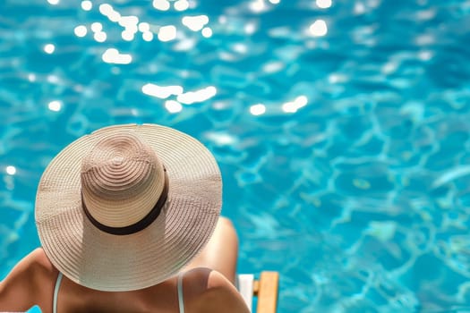 Fashionable woman in the back wearing a straw hat while on vacation at luxury poolside in resort.