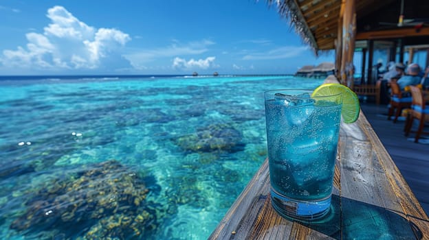 Blue Lagoon at an overwater bungalow in the Maldives, the water's hue matching the cocktail's vibrant color.
