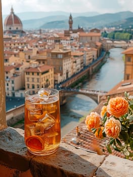 Aperol Spritz on a balcony overlooking the orange rooftops of Florence, symbolizing Italian aperitivo culture.