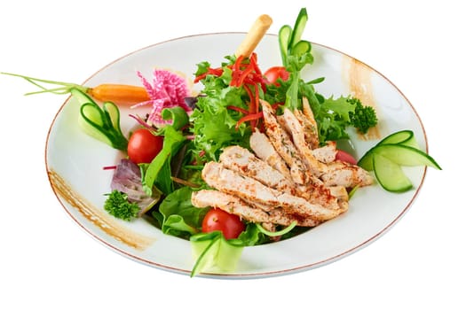 Fresh salad with grilled chicken breast, arugula and tomato. Top view