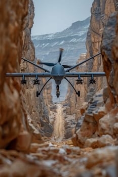 A military unmanned aerial vehicle UAV patrols the area in the gorge of the mountain.