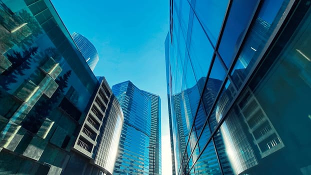 Office buildings. Skyscrapers in the business center. Modern architecture, glass facade of residential or commercial real estate