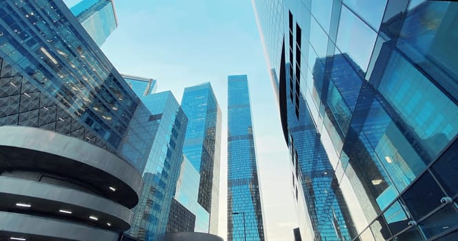 Office buildings. Skyscrapers in the business center. Modern architecture, glass facade of residential or commercial real estate