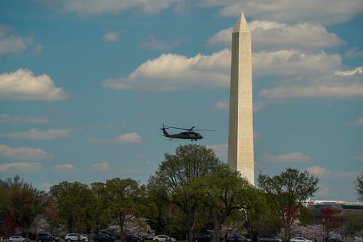 helicopter flying near the george washington monument view from a cruise on potomac river washignton dc on riverboat water taxi