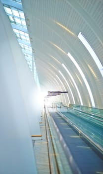 Airport, building and design with interior and window in futuristic architecture for travel, aircraft and flight. Modern urban and editorial with walls for movement, destination and travelers.