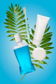 Transparent plastic bottle with bubbles and blue liquid on isolated background. Antiseptic mouth rinse       