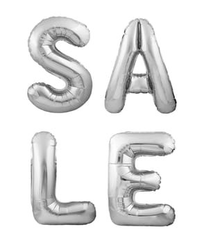 Silver helium balloons forming the word SALE isolated on white background