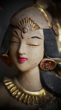 statue of a Balinese or javanese dancer used as garden gnome decoration, javanese gnome indonesia asian garden statue