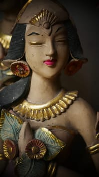 statue of a Balinese or javanese dancer used as garden gnome decoration, javanese gnome indonesia asian garden statue