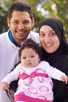Portrait of mother, father and baby in park for bonding, relationship and outdoors together. Muslim family, nature and happy parents with newborn infant for love, childcare and support in garden.