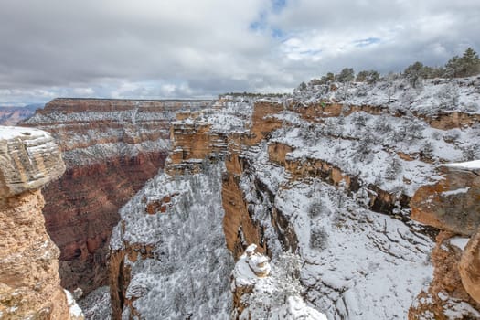 Fresh snow has fallen at the South Rim of The Grand Canyon at Grand Canyon National Park, Arizona