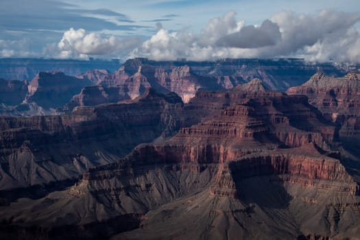 Passing rain storm produces clouds that filter the sunlight at Grand Canyon National Park, Arizona