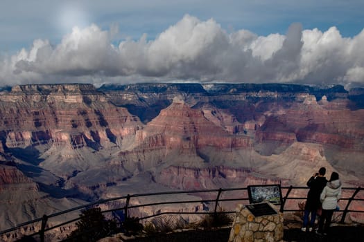 Passing rain storm produces clouds that filter the sunlight at Grand Canyon National Park, Arizona