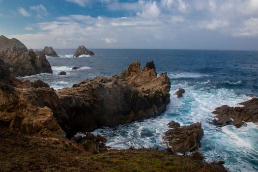 Waves crash along the coastline at Point Lobos State Natural Reserve in California