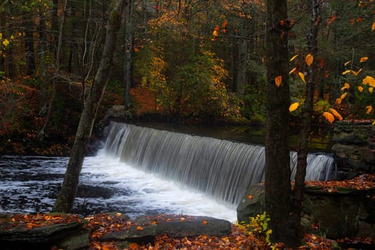 Fall colors have arrived along a river near Weston, Connecticut