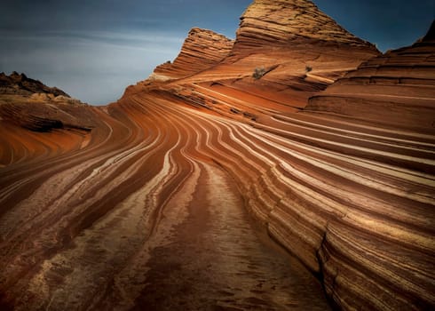 Parallel lines of eroded sandstone producing vivid colors make up the landscape at Sand Cove at North Coyote Buttes on the Arizona/Utah border.
